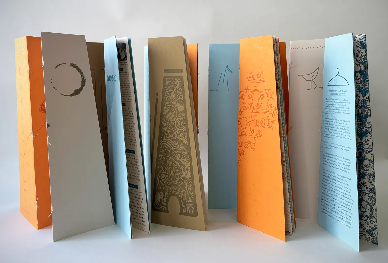 The booklets standing open, accordion-style