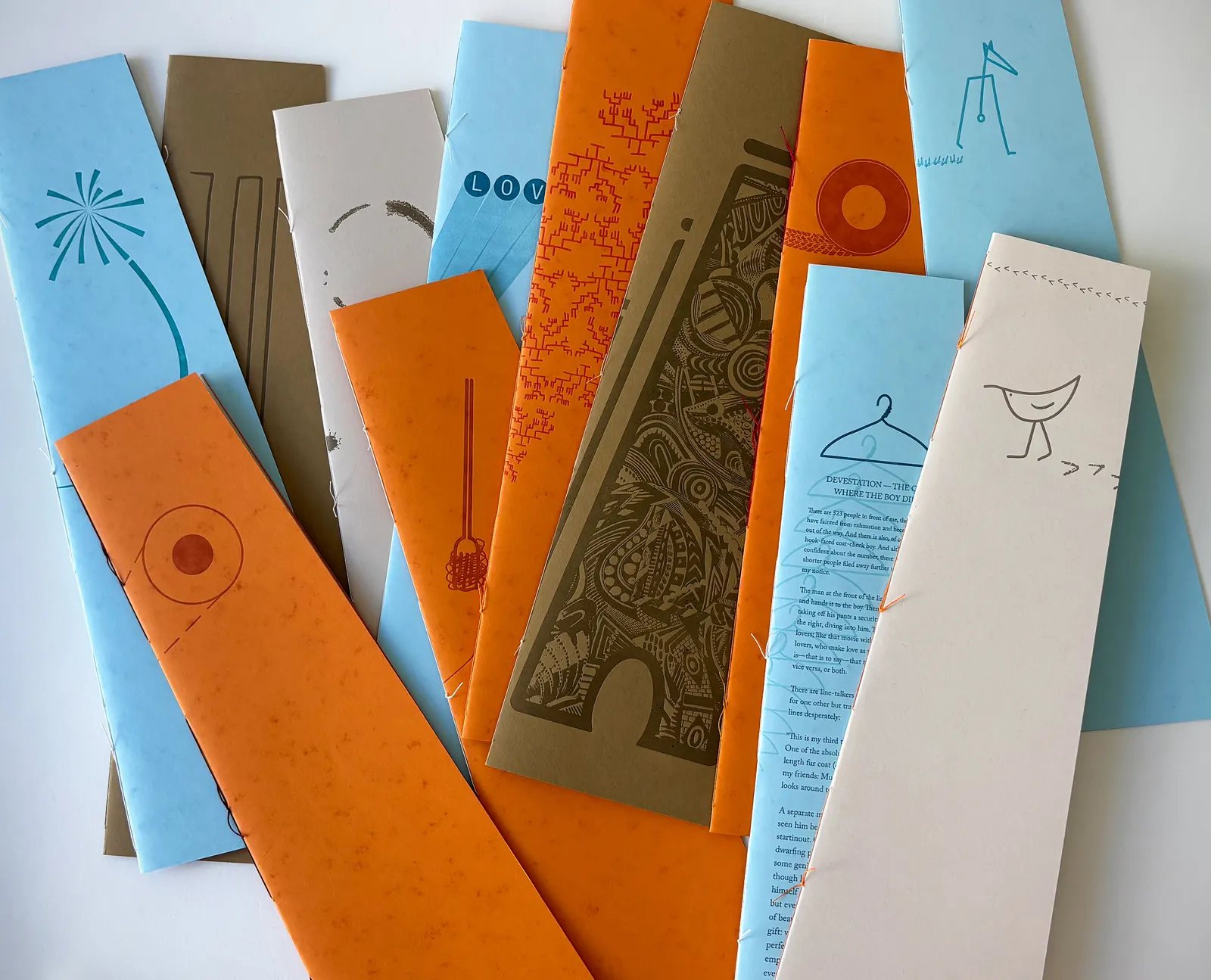 The twelve booklets fanned out